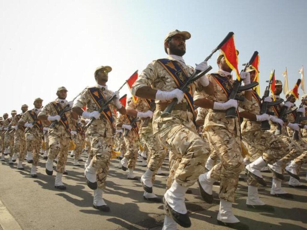 members of iranian revolutionary guard march during parade to commemorate anniversary of iran iraq war, in tehran